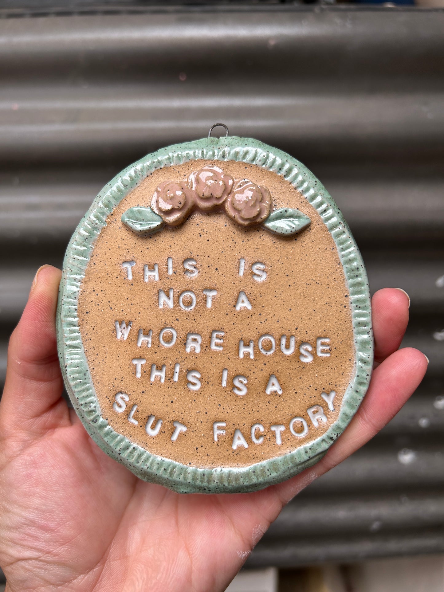 This is a Slut Factory Wall Art