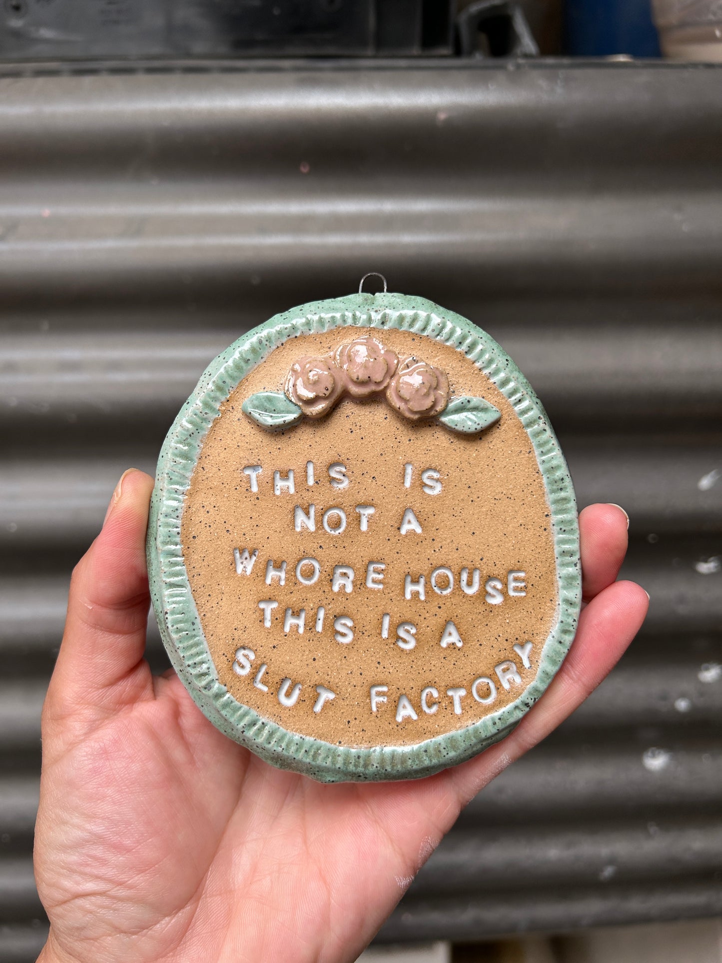 This is a Slut Factory Wall Art