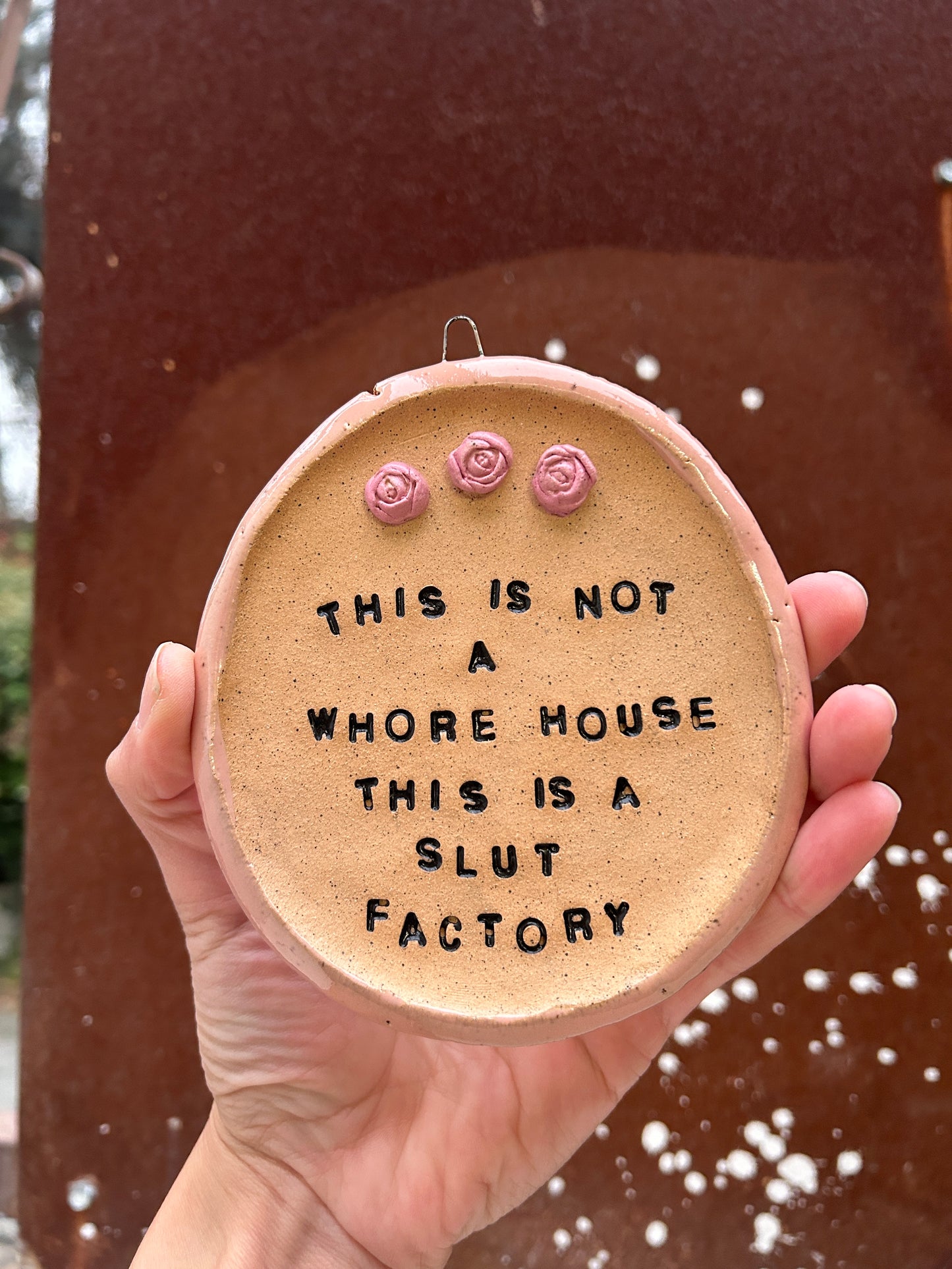 This is a Slut Factory Wall Art